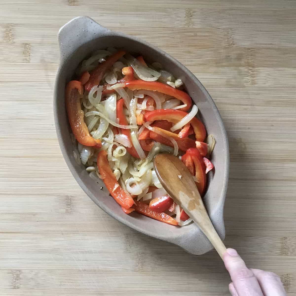 Sauteed vegetables in a casserole dish. 