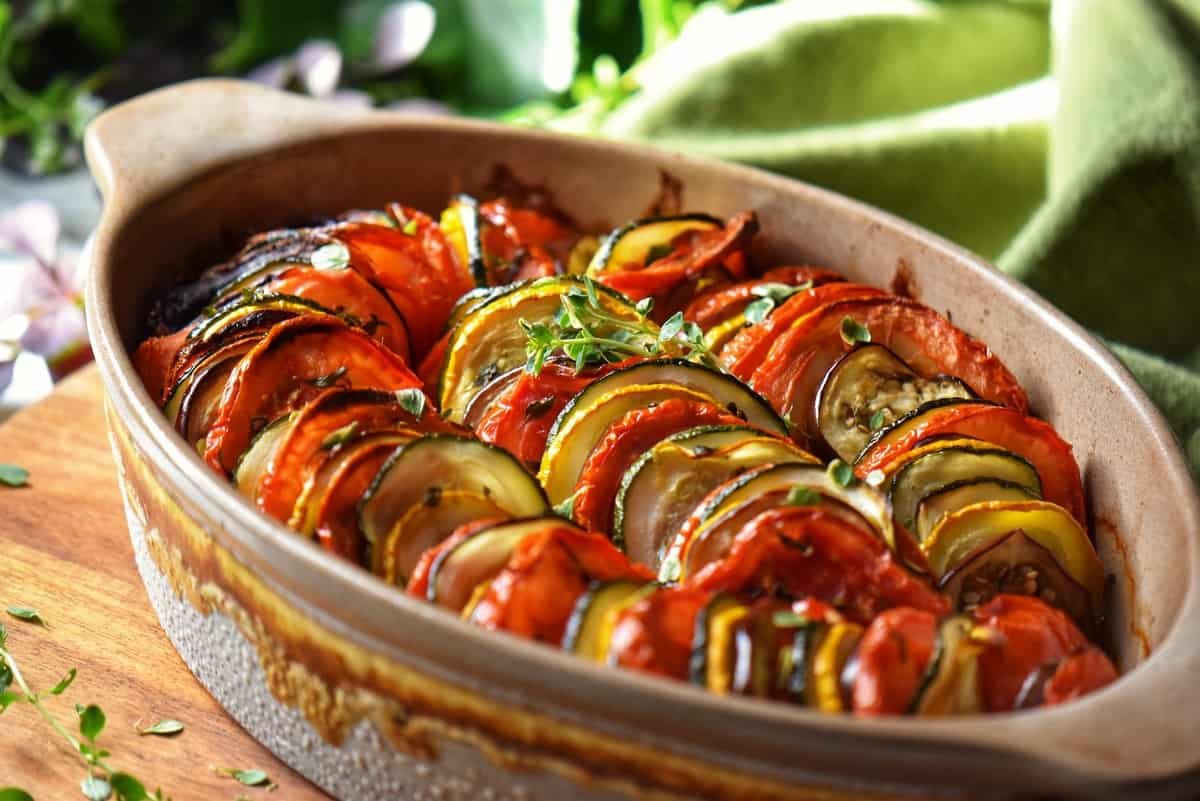 Roasted Italian vegetables in a casserole dish. 