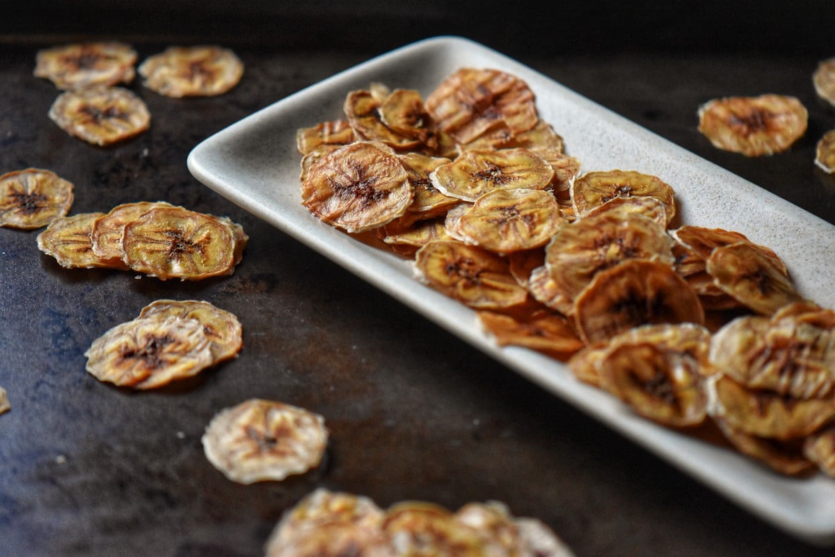 Dried bananas on a white dish.