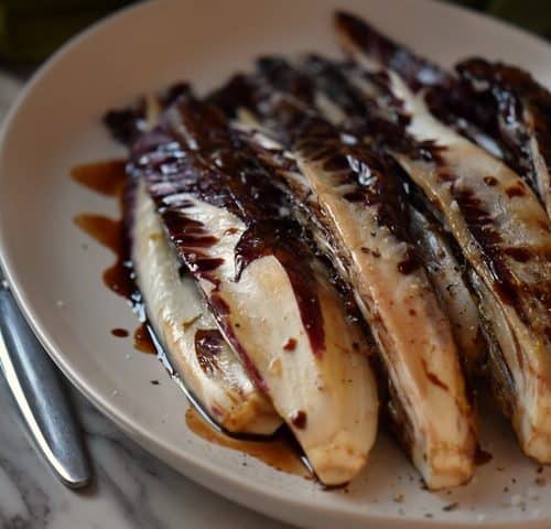 Grilled radicchio ready to be served as a side dish.