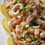 A close up of the seafood salad consisting of calamari, shrimp, octopus and scallops.