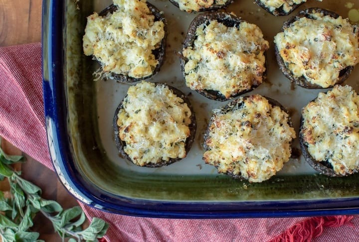 An overhead shot of baked mushrooms made with homemade ricotta cheese.