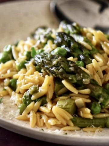 A bowl of spring vegetables combined withe orzo risotto make the perfect side dish.