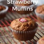 Banana Strawberry muffins on a cooling rack.