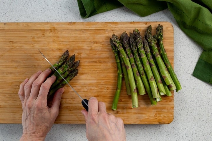 Asparagus tips are in the process of being cut.