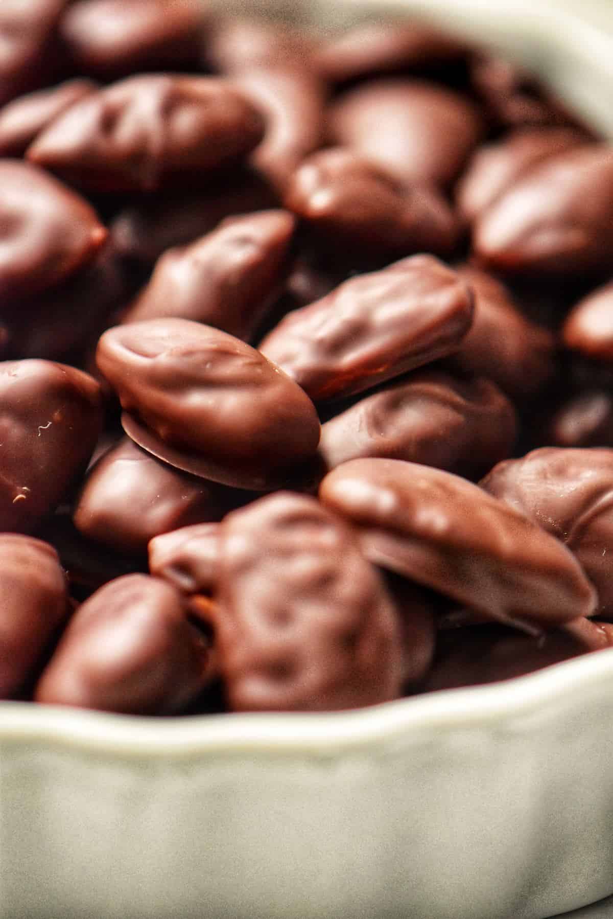 A close up shot of the chocolate covered almonds.
