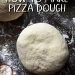 A pizza dough ball on a floured surface.