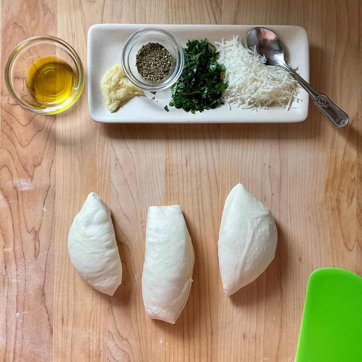 Prepared ingredients to make garlic knots.