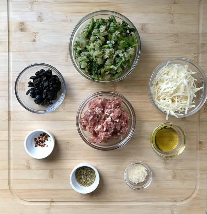 Some of the ingredients required to make this pizza rolls recipe include sauteed broccoli rabe, loose Italian sausage and mozzarella.