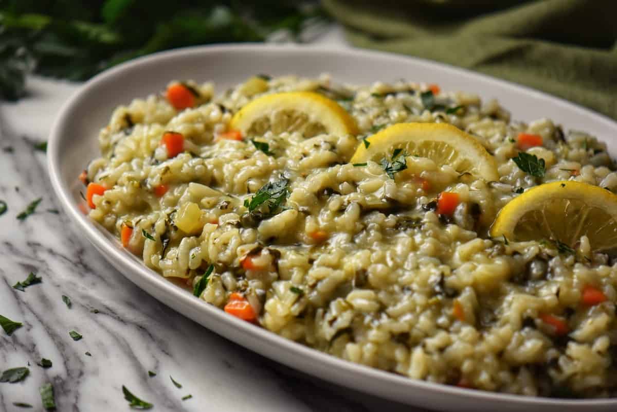 Spinach and Parmesan risotto in a white serving dish.