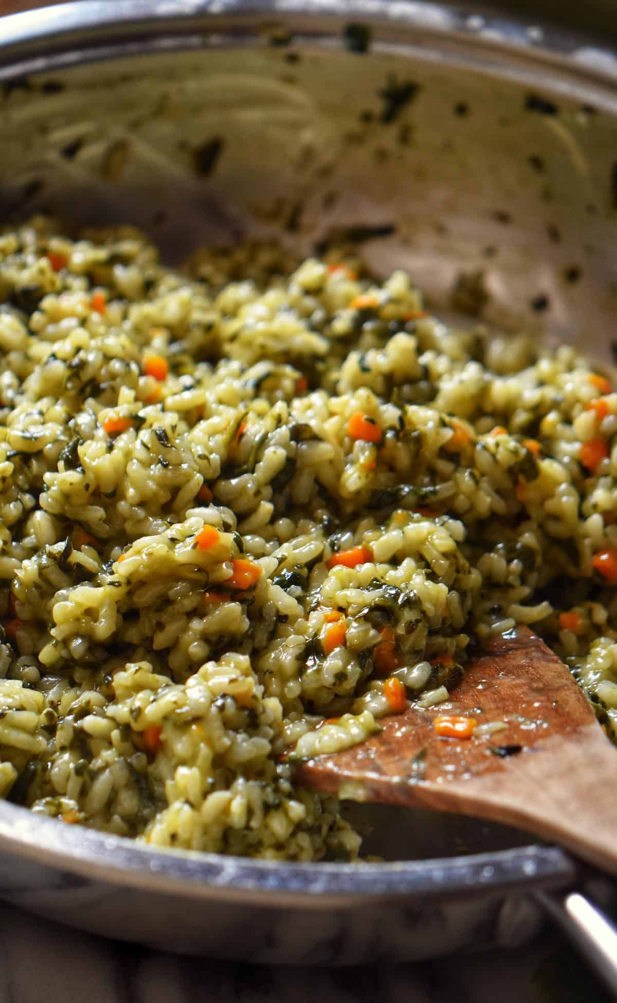 A large saucepan of spinach risotto.