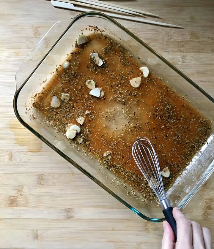 The marinade is being whisked together.