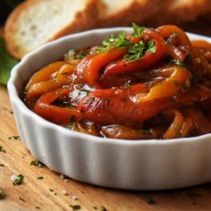 Italian Marinated Bell Peppers in a white ceramic dish.