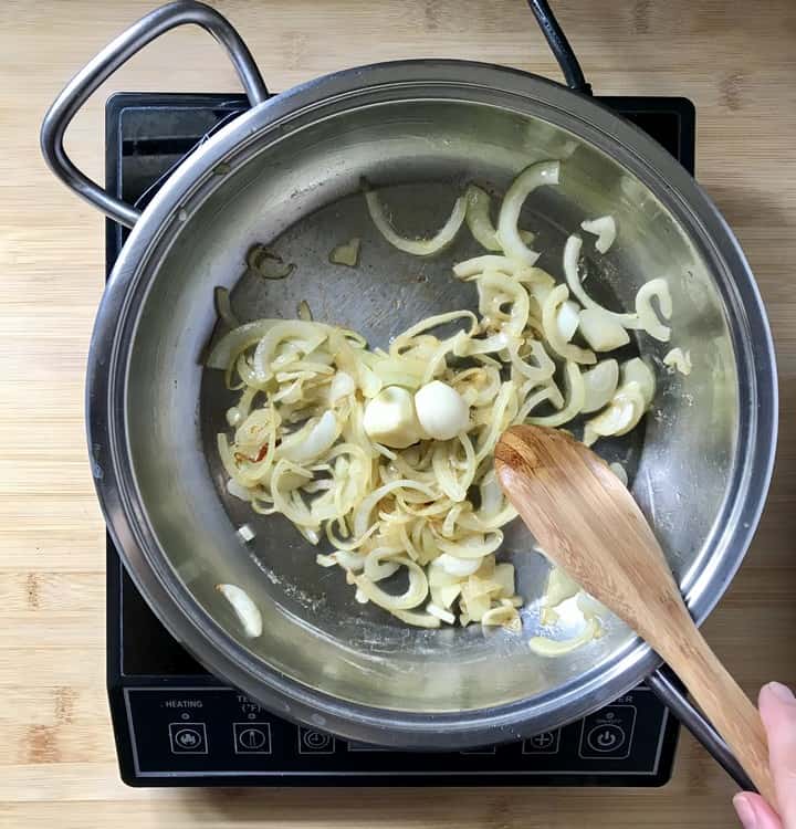 Sauteed onions and garlic in a pan.