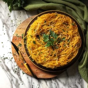 An overhead photo of spaghetti pie in a round dish.