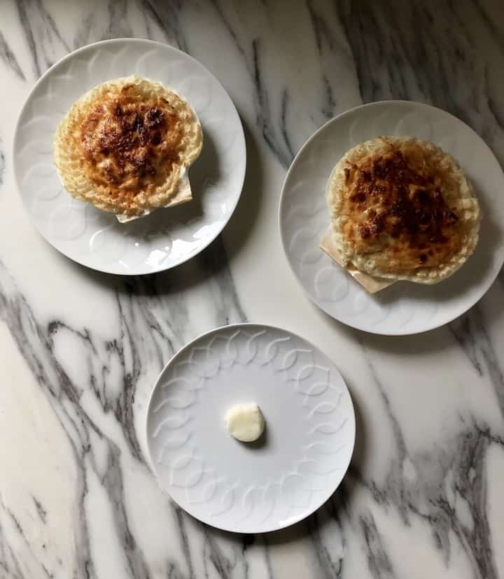 A dollop of mashed potato on a plate to keep the Coquilles St Jacques form slipping off.