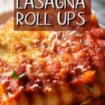 A close up of the cheesy topping of spinach lasgana roll ups.