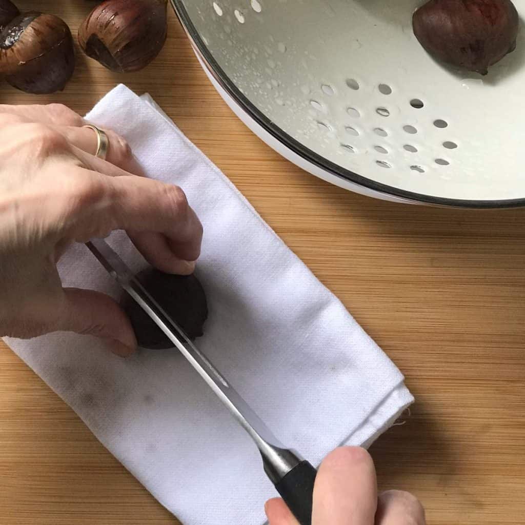 A chestnut in the process of being scored.