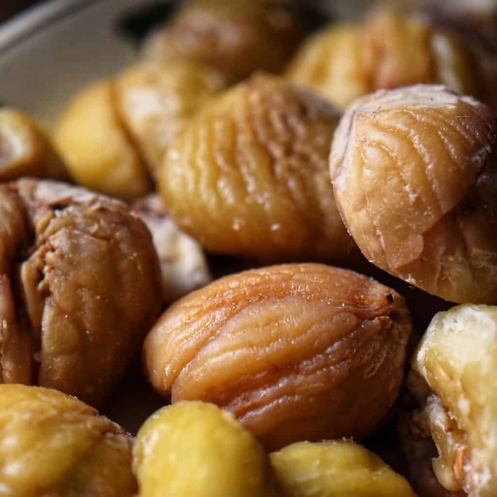 A close up photo of chestnuts without their shells.