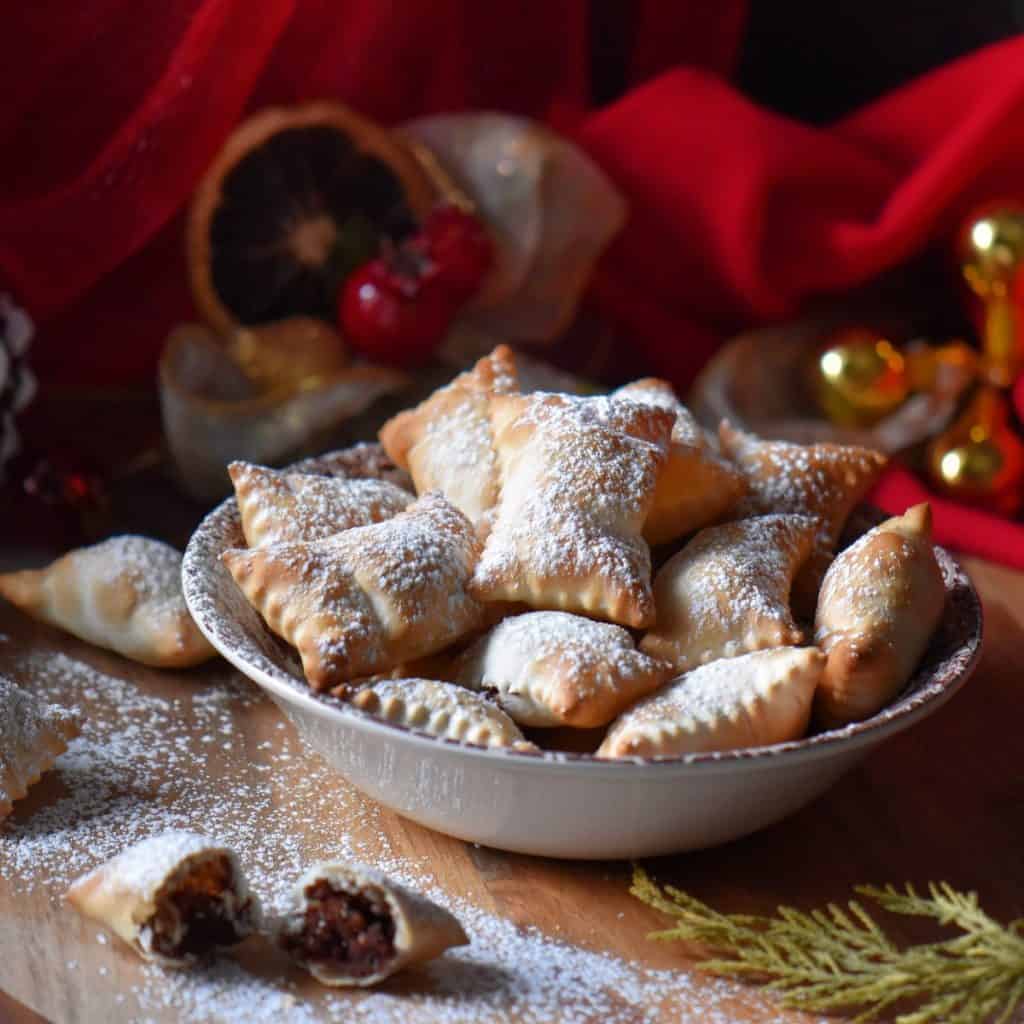 A bowl of Italian chestnut cookies in a ceramic dish.