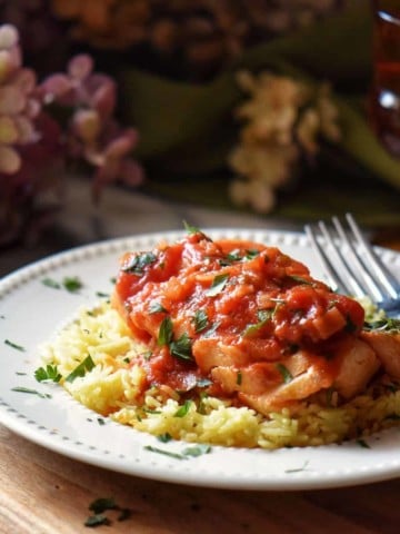 Italian cod with tomato sauce on a bed of rice.