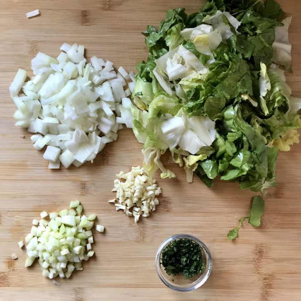 Chopped vegetables on a wooden board.