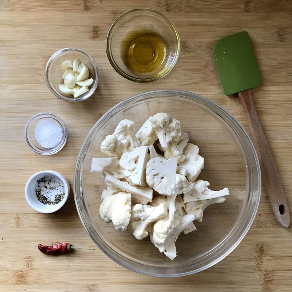 Cauliflower florets in a large bowl.