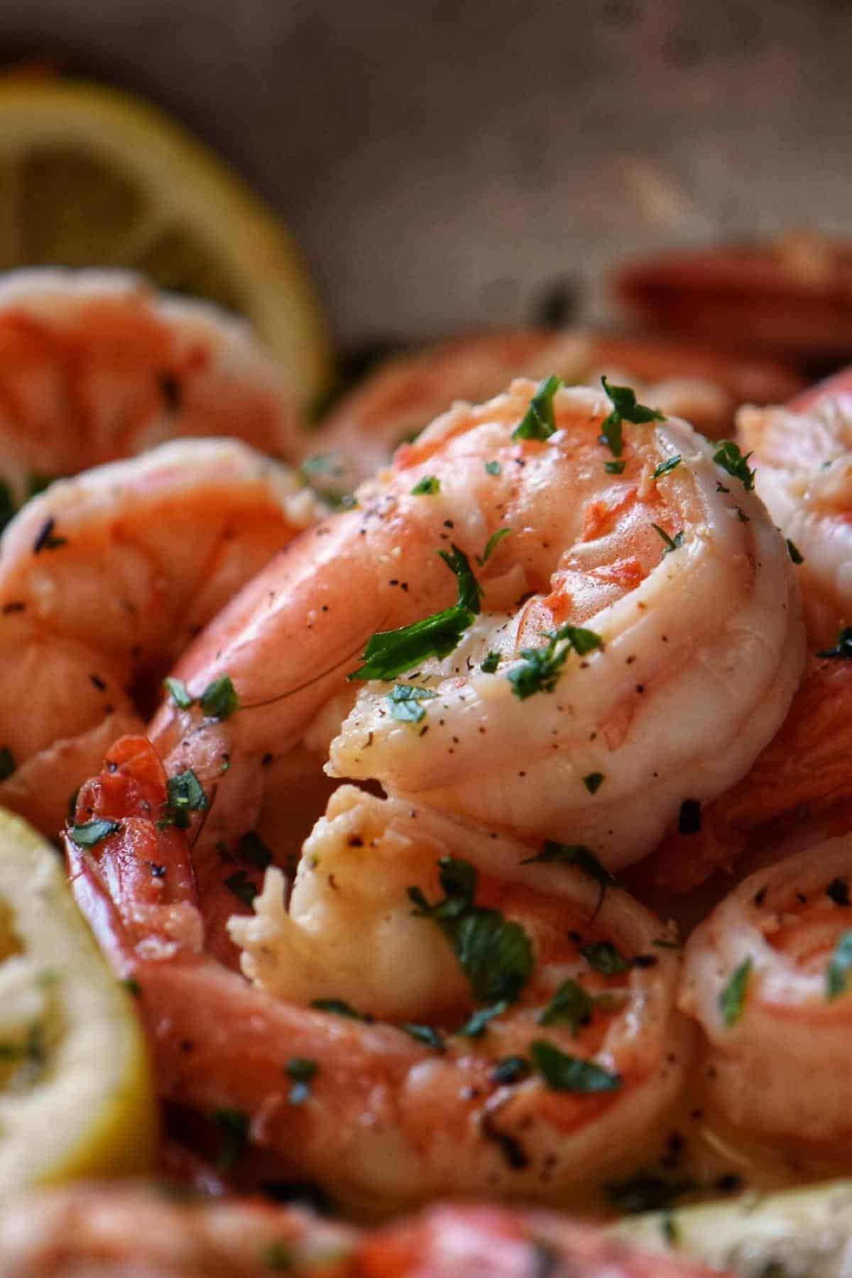 Lemon garlic shrimp garnished with chopped parsley.