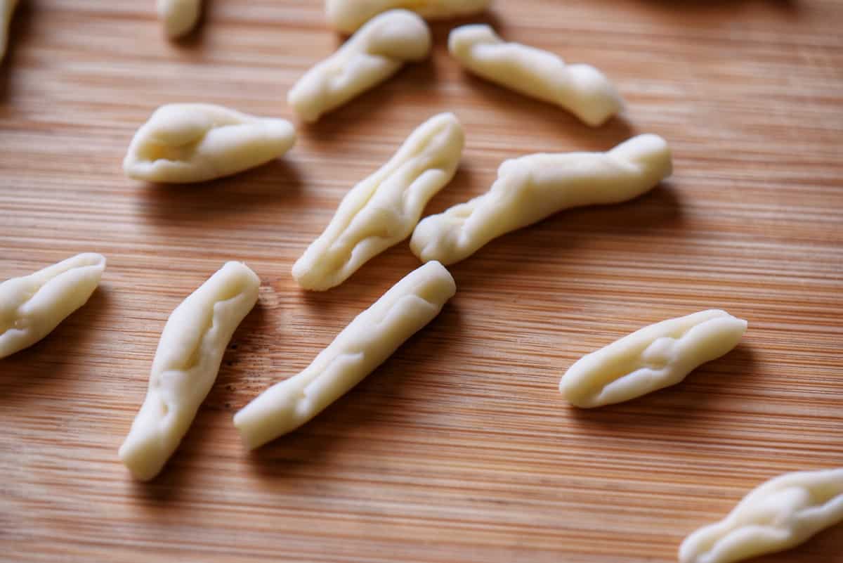 Homemade pasta on a wooden board.