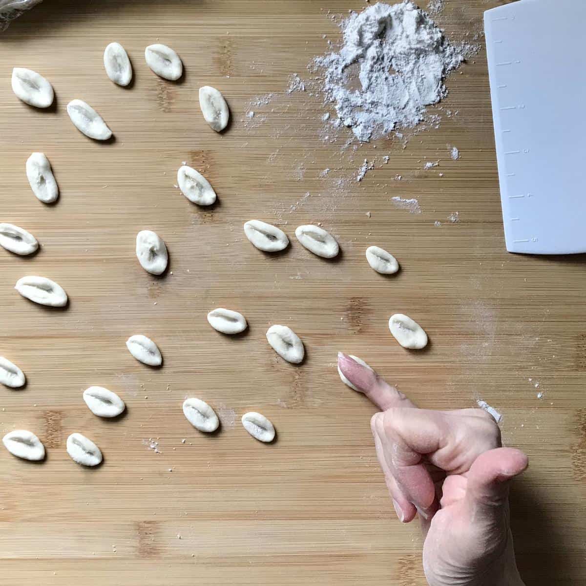 Cavatelli pasta on a wooden board. 