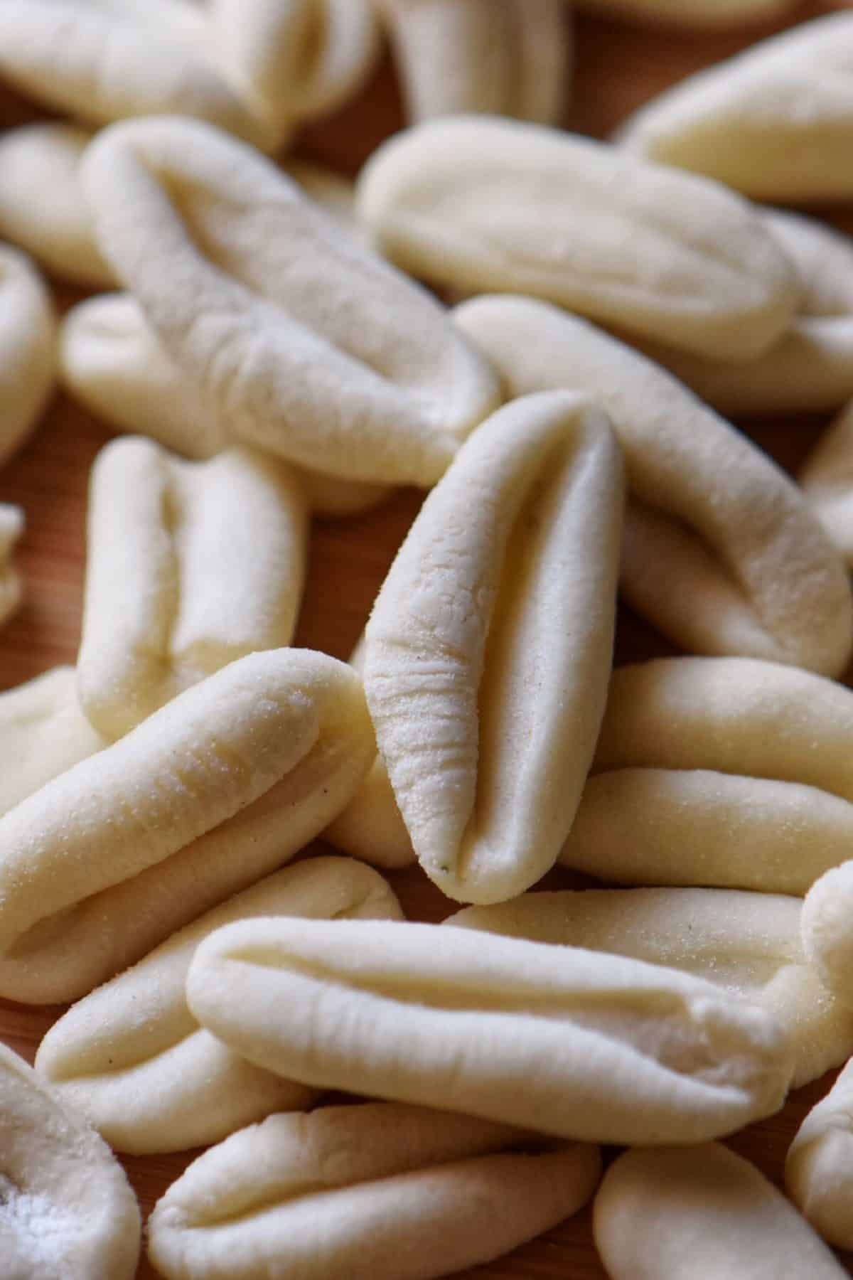 Freshly made ricotta cavatelli in a small pile.