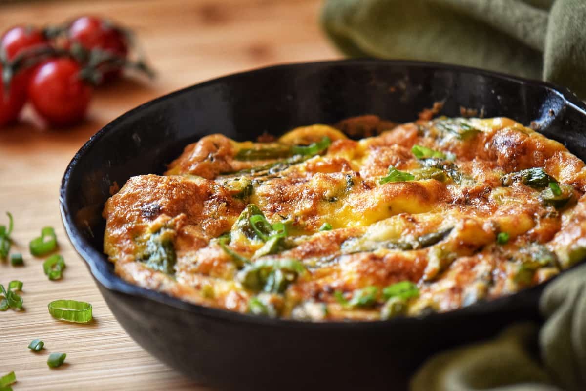 Asparagus frittata in a cast iron pan.