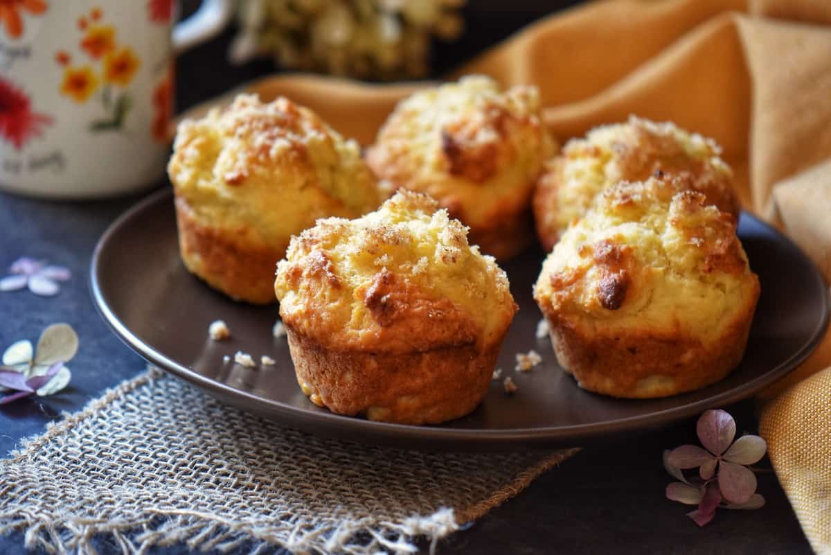 Lemon muffins on a plate.