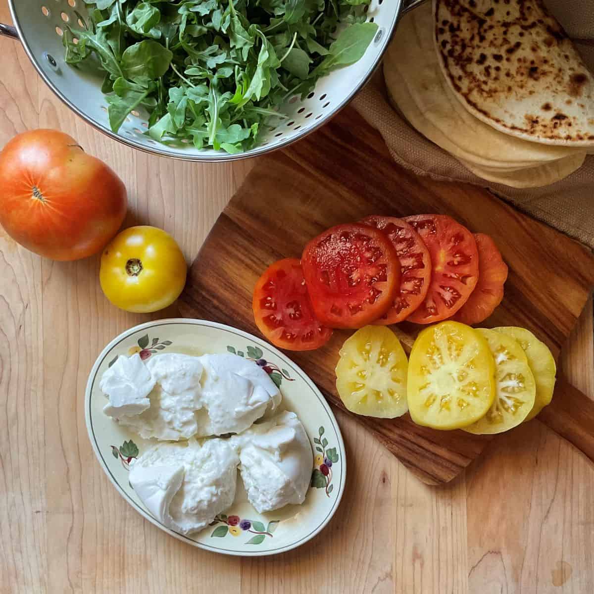 Prepped ingredients to make a piadina sandwich.
