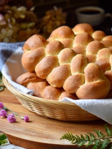 A braided sweet dough recipe in a wicker basket.