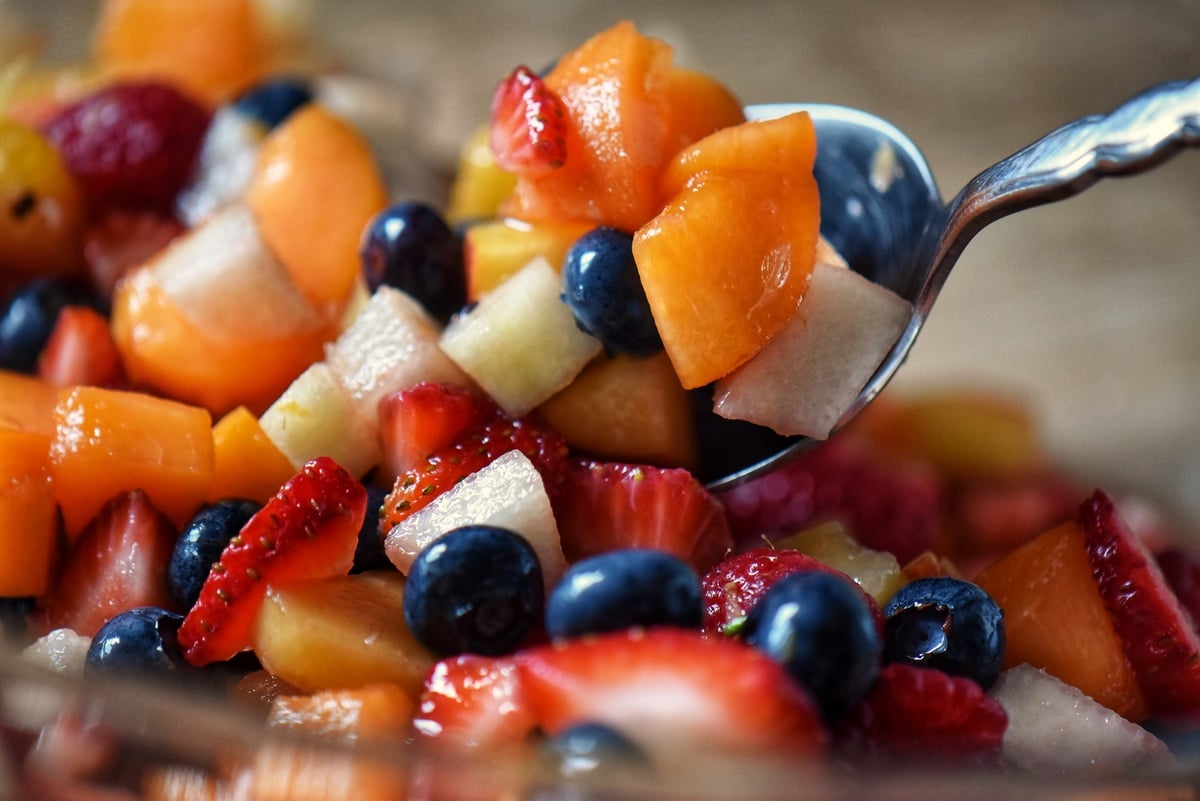 Fresh fruit salad scooped in a bowl. 