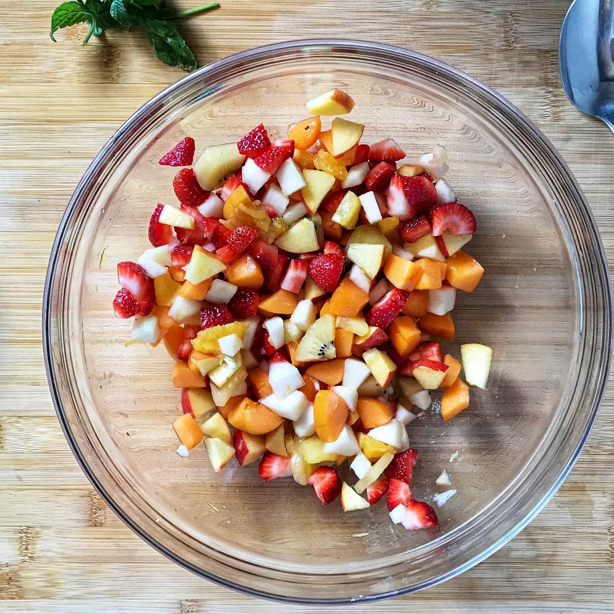 A large bowl of fresh fruit salad.