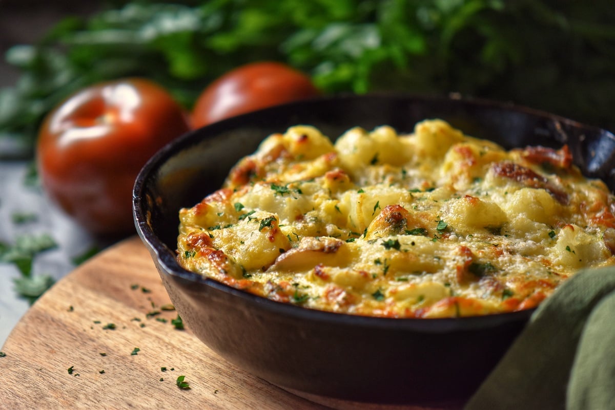 A potato egg frittata in a cast iron pan. 