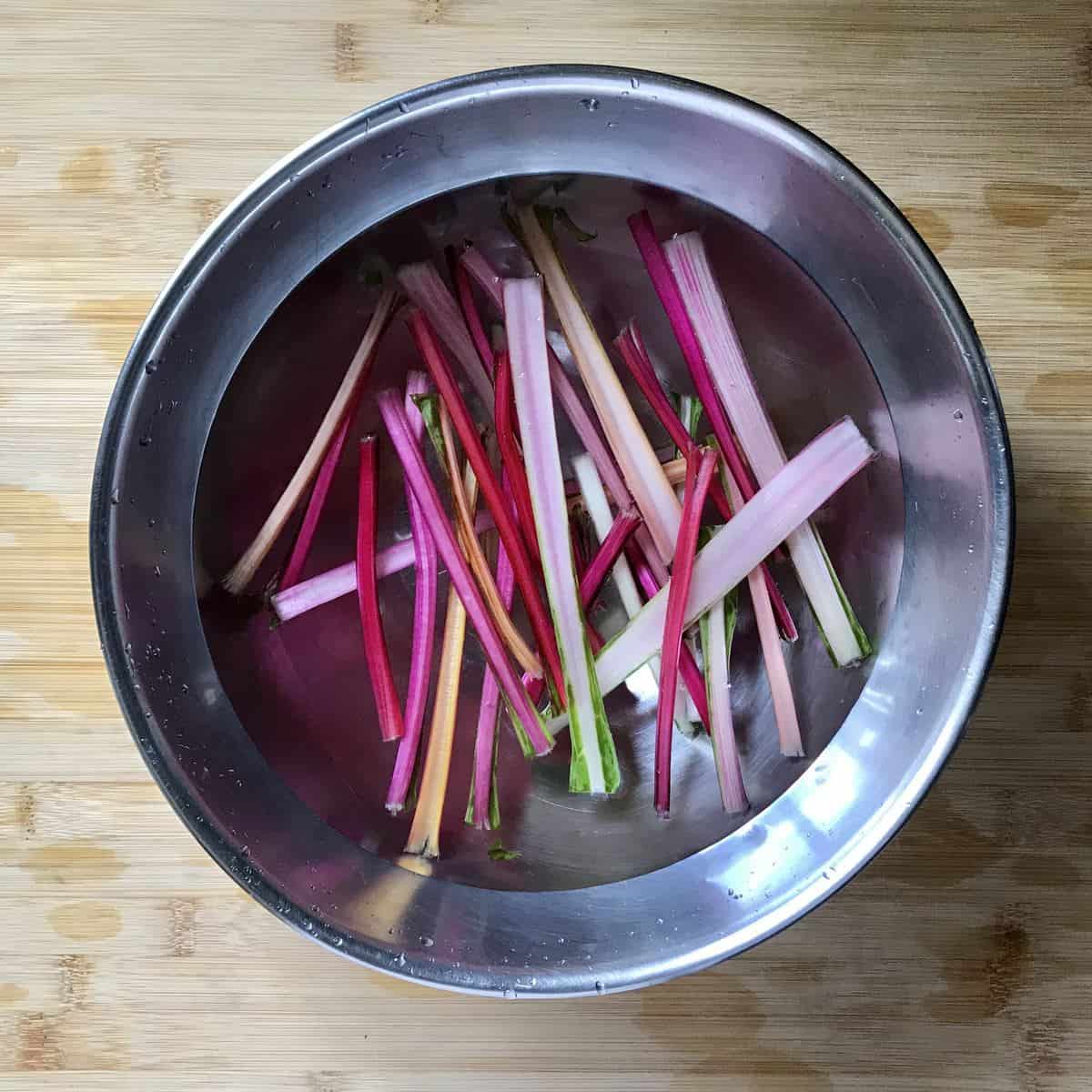 The ribs of chard soaking in water.