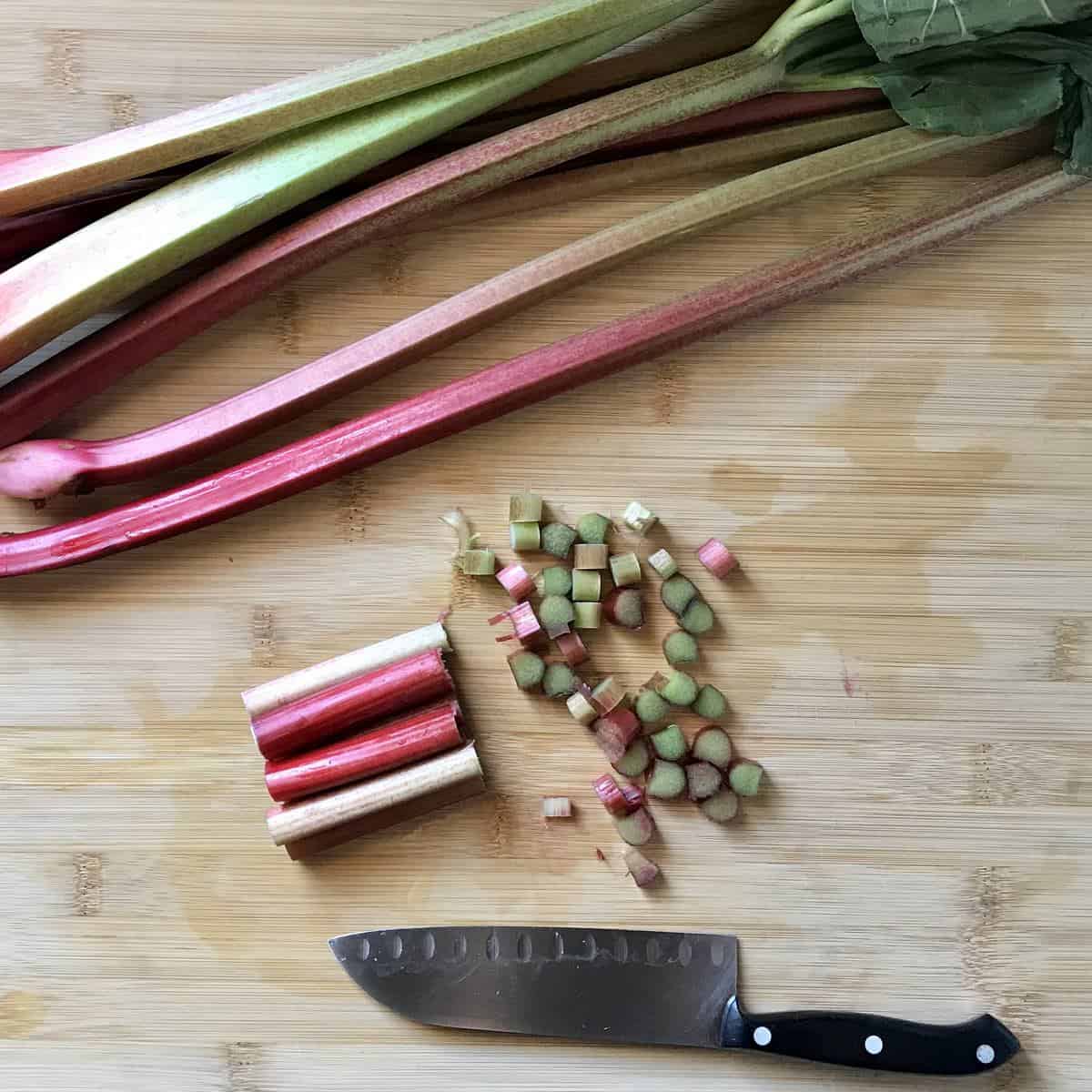 Chopped rhubarb on a wooden board.