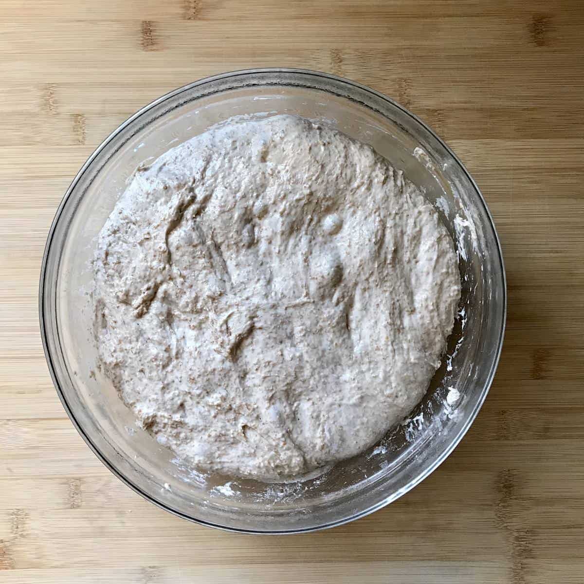 Bubbly whole wheat pizza dough after spending 24 hours in the fridge. 