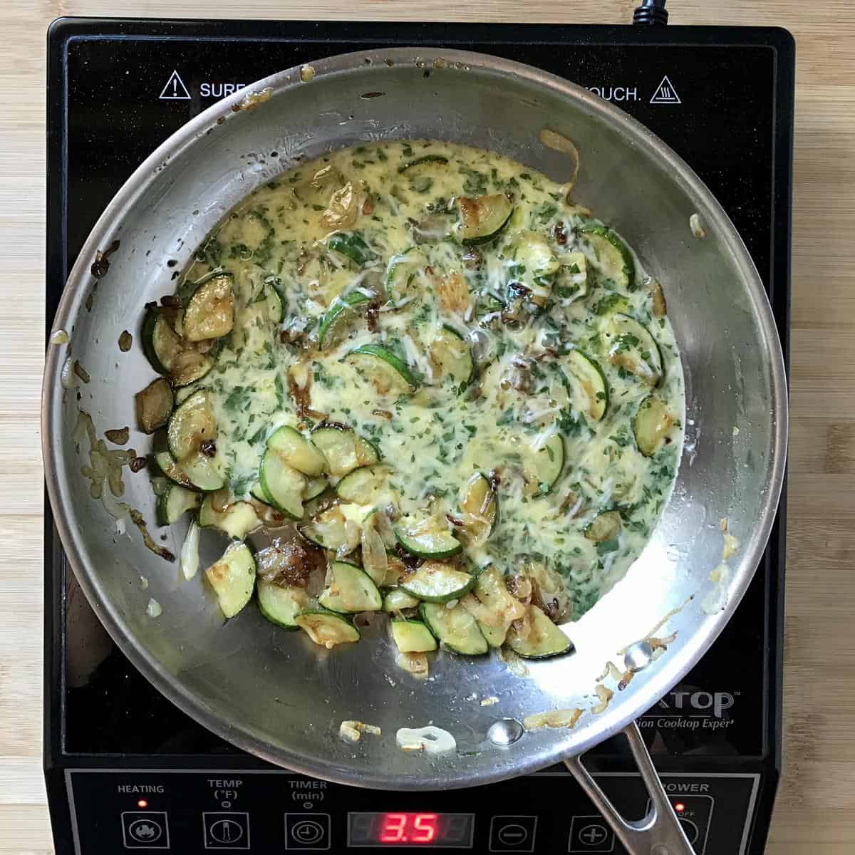Whisked eggs sauteed with zucchini and onions.