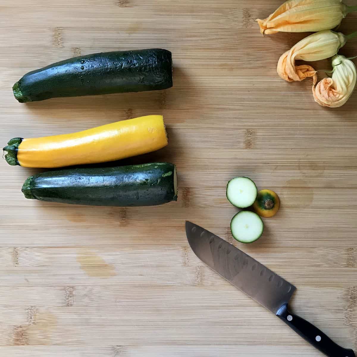 Fresh zucchini with the flower end cut off.