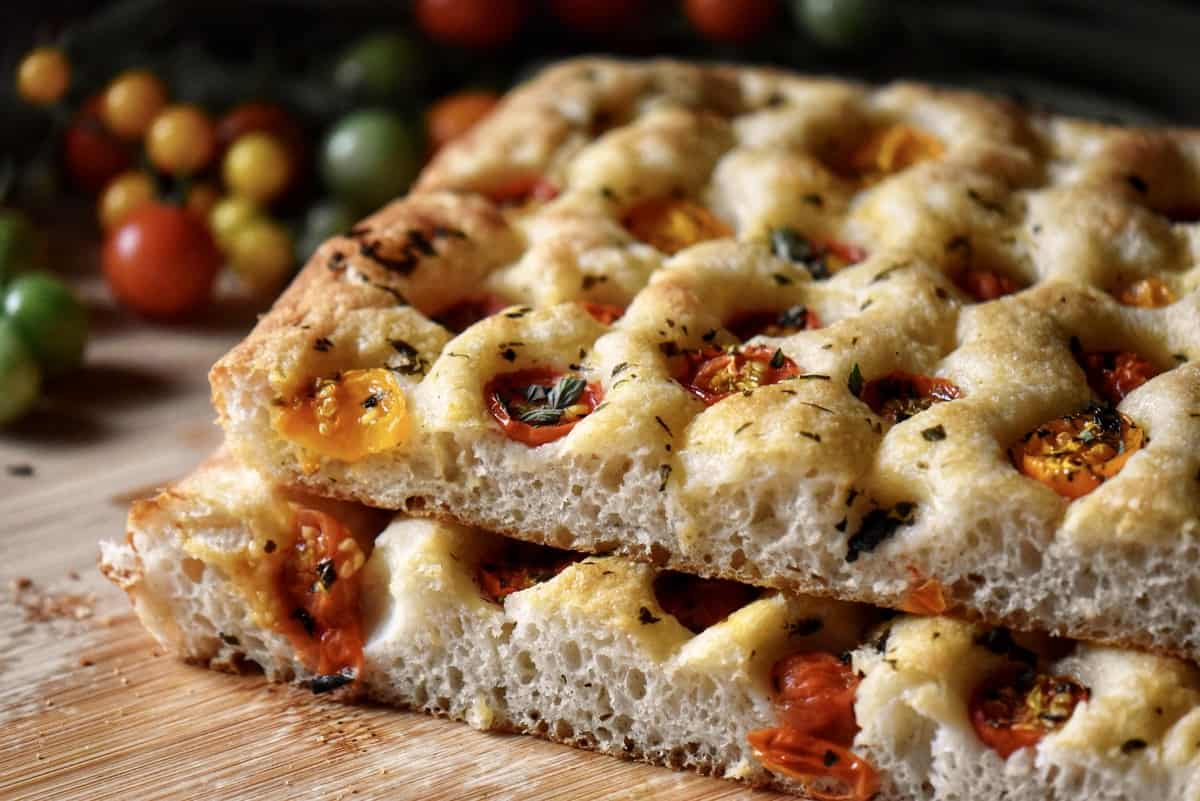 The soft tender interior of focaccia bread is visible. 