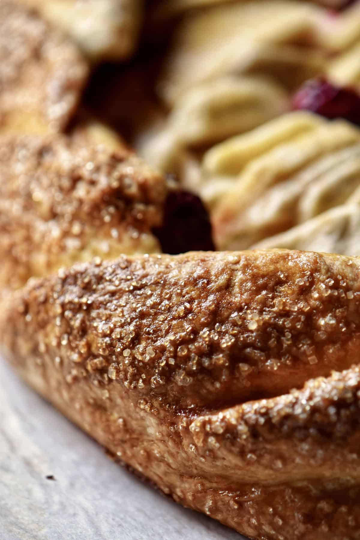 A close up of the crust of an apple crostata recipe.