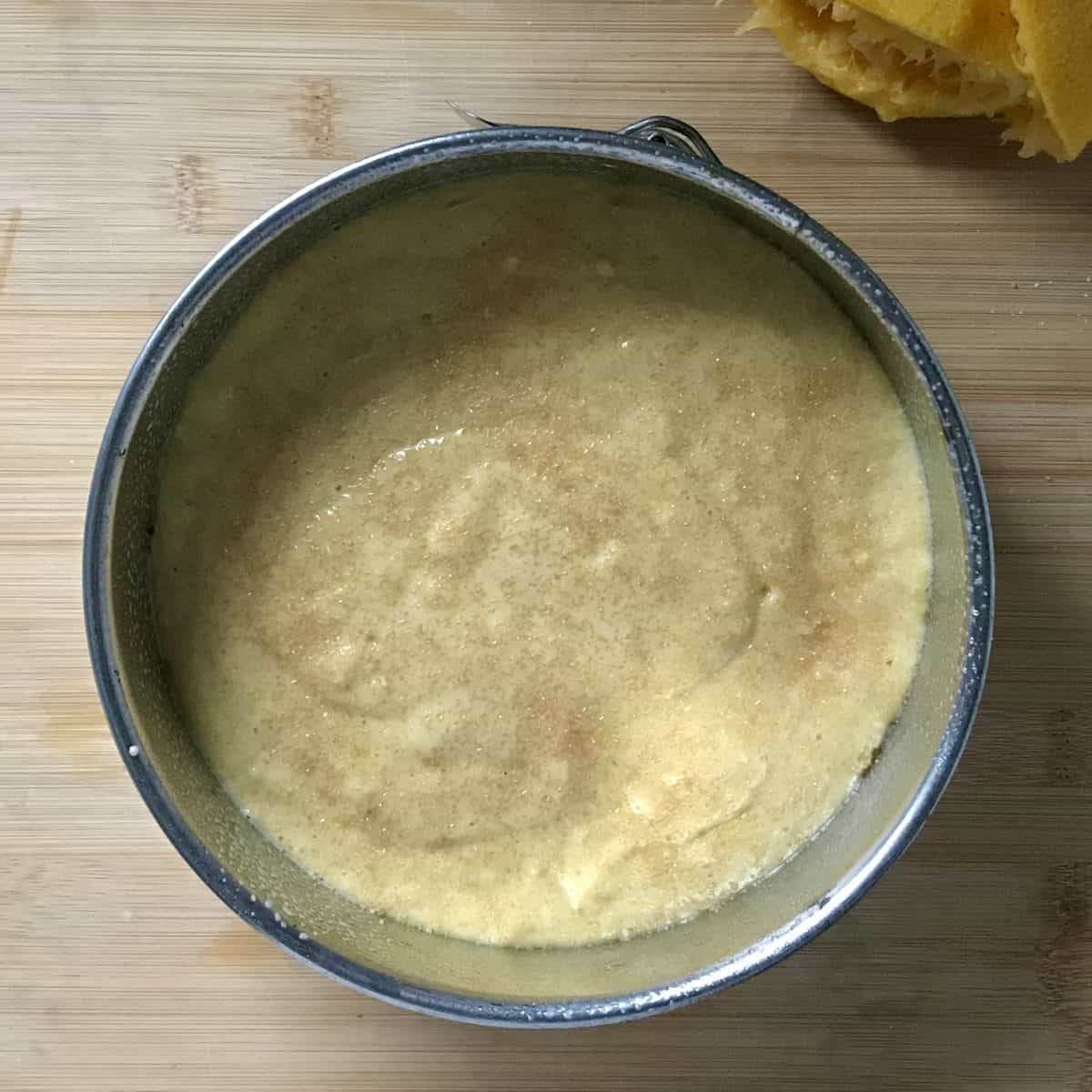 An overhead photo of the cake batter in a springform pan. 