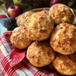 Savory cheese and apple muffins piled high.