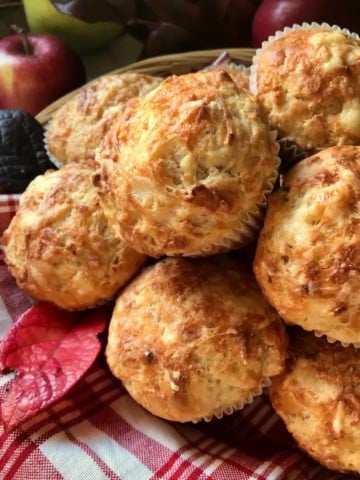 Savory cheese and apple muffins piled high.