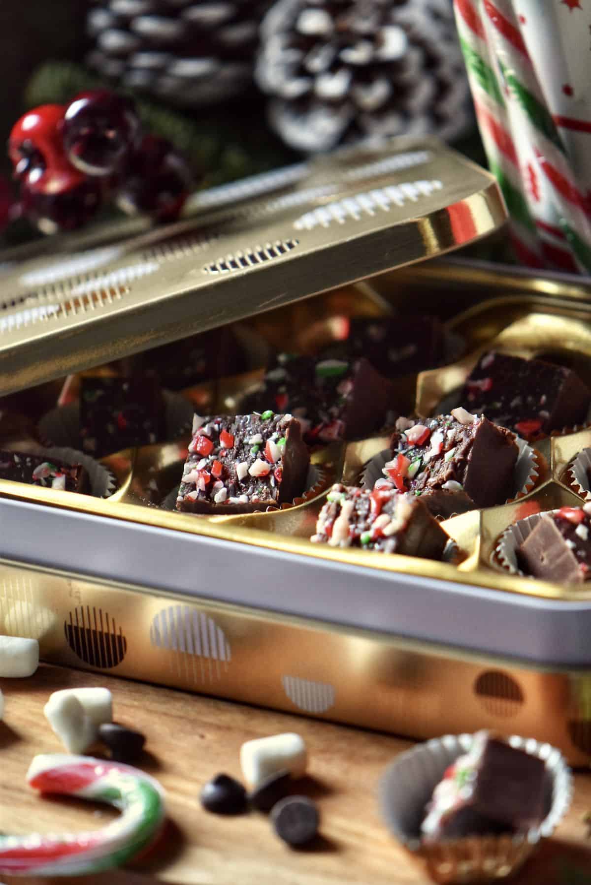 A decorative tin filled with homemade fudge. 