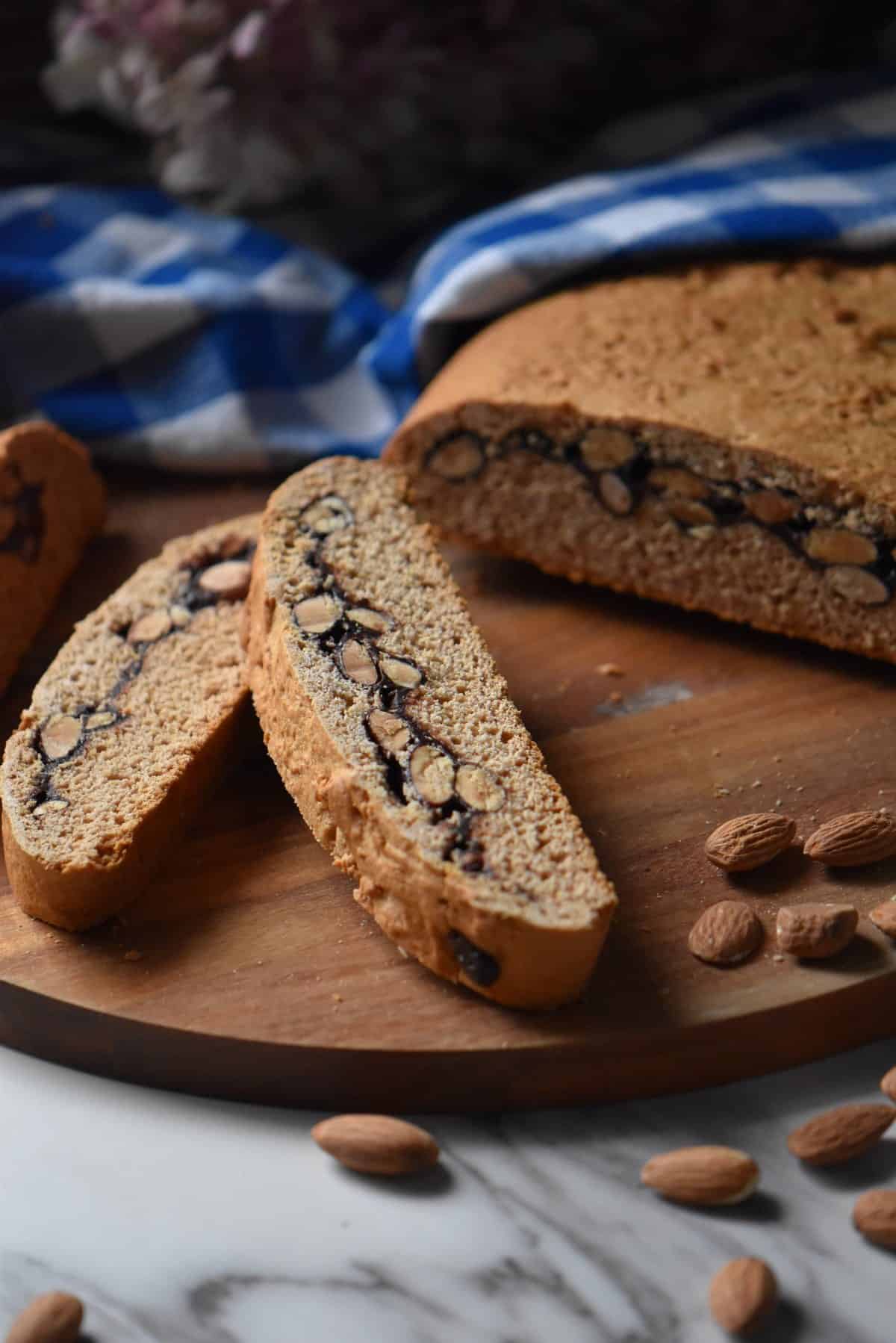 Sliced biscotti cookies on a wooden board. 